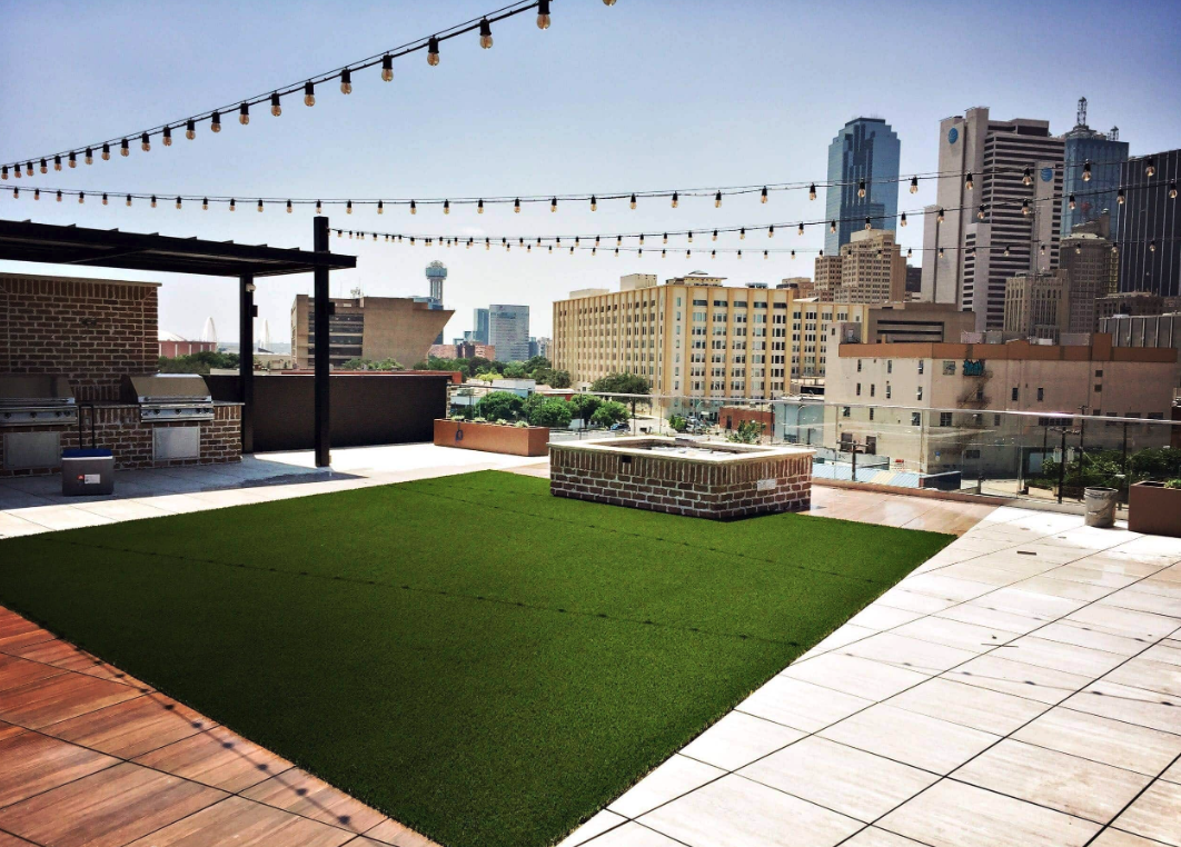 Lounge area roof deck with synthetic grass.