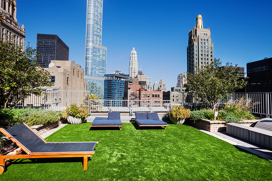 Apartment turf roof deck lounge area.