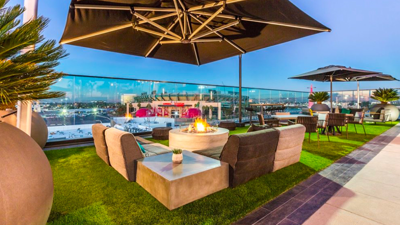 Roof top lounge with artificial grass.
